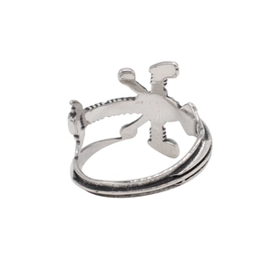 Close-up of industrial silver steel ring featuring a unique polygonal mechanical rotation design