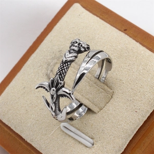 Detailed close-up of a Gothic sword ring with a skull engraving in a jewelry box