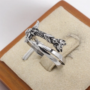 Macro shot of a vintage sword hilt texture on a polished stainless steel wrap ring