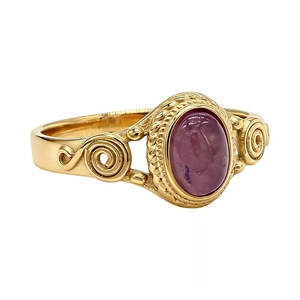 Retro hollow gold steel ring featuring a large oval pink gemstone and filigree details