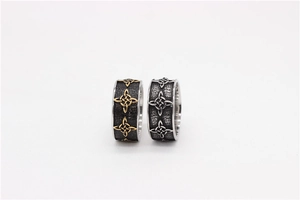 Close-up of gold and silver Celtic knot rings with vintage textured background detailing