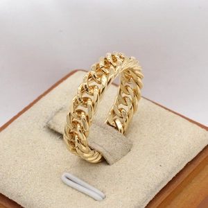 Men's gold Cuban link chain ring in minimalist stainless steel industrial style
