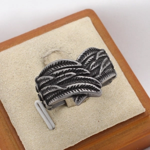 Vintage stainless steel men's ring with detailed feather wing design and oxidized silver finish