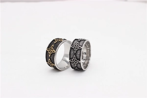 Close-up of vintage Celtic knot rings in gold and silver finish on stainless steel