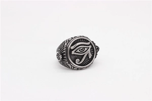 Detail of vintage Eye of Horus relief on stainless steel ring with antique finish