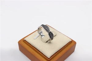 Macro detail of retro feather wing texture on men's vintage titanium steel ring