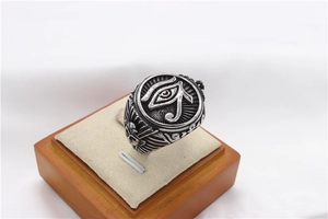 Detail of vintage Egyptian Eye of Horus steel ring with retro oxidized engraving
