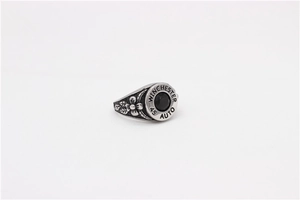 Detailed view of retro steel ring featuring a black gemstone and floral engravings