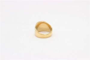 Detailed top view of a wide gold stainless steel ring with a smooth polished finish