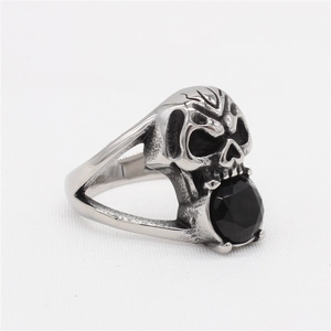 Vintage stainless steel skull ring for men with a large faceted black gemstone in its mouth