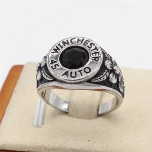Vintage steel ring for men with black gemstone and Winchester 45 Auto relief design