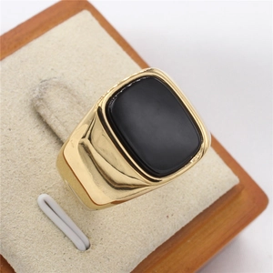 Men's rectangular black gemstone signet ring with a polished gold-finished band