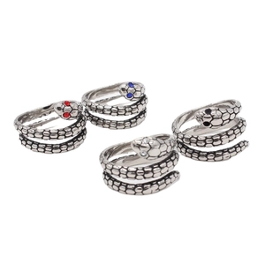 Set de cuatro anillos de serpiente vintage con piedras de colores y escamas plateadas