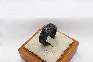 Detailed relief of the Eye of Providence on a rotating black stainless steel ring for men