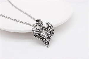 Detail of vintage eagle and star shield pendant on square pearl chain in a white tray