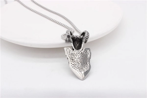 Detailed view of silver Viking ram head shield pendant on a stainless steel square chain