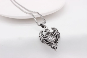 Detailed close-up of vintage eagle pendant with star shield on a stainless steel box chain