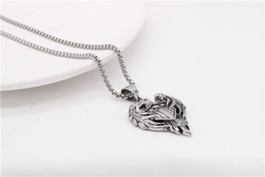 Close-up of vintage steel necklace featuring a double-headed eagle and shield pendant