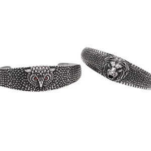 Vintage stainless steel open bangles featuring detailed owl and lion head designs