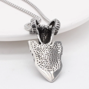 Vintage viking ram shield pendant necklace in matte silver finish on white ceramic