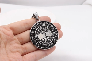 Close-up of Viking Tree of Life pendant with Nordic runes in vintage steel finish