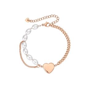 Detail of rose gold pearl bracelet showing heart pendant and lobster clasp closure