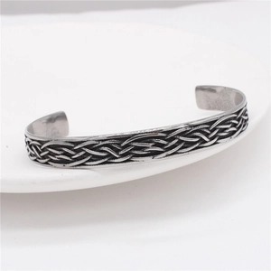 Retro oxidized silver titanium steel feather bangle with intricate woven textures