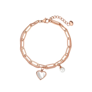 Detail of rose gold double-layer bracelet with paperclip chain and heart mother of pearl charm