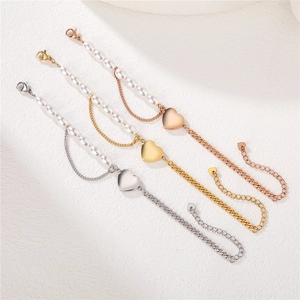 Minimalist pearl and link chain heart bracelet in gold, silver, and rose gold finishes