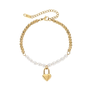 Detail of beaded pearl bracelet featuring a gold heart lock pendant and K18 hallmark tag