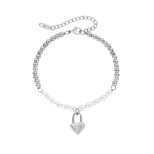 Detail of titanium steel bracelet with beads, pearls, heart charm and K18 tag