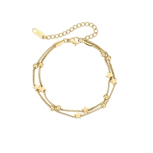 Detail showing gold double-layer star bracelet with S.STEEL stamp and lobster clasp