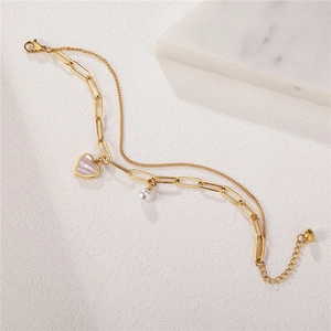 Golden double-layer bracelet with heart mother-of-pearl and pearl charm detail