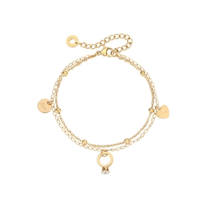 Detailed macro view of gold-plated double-layer bracelet with heart and ring charms