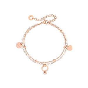 Detail of rose gold double-layer chain bracelet with heart, disc, and ring charms