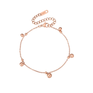 Detailed macro view of rose gold beaded bracelet with 18KGP tag and lobster clasp