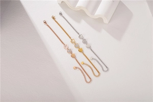 Detailed view of three-heart bracelets in rose gold, gold, and silver stainless steel