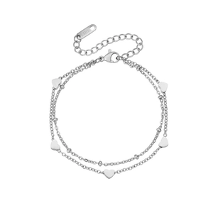 Macro detail of silver double-layer stainless steel bracelet with five polished heart charms