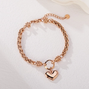 Rose gold Cuban link bracelet with heart pendant and textured ring details for women