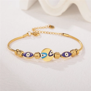 Chic gold titanium steel bracelet featuring beaded evil eye charms and snake chain