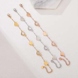 Three elegant heart bracelets in gold, silver, and rose gold with white shell inlays