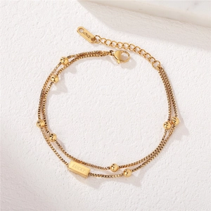 Double-layered 18KGP gold chain bracelet with beads and engraved LUCKY pendant for women