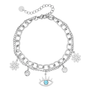 Bracelet chaîne cubaine argentée avec pendentifs œil bleu et fleurs en zircon sur fond blanc