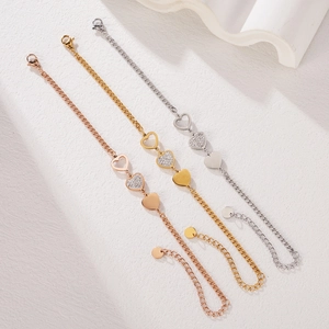 Three-tone heart pendant bracelets in gold, rose gold and silver finish with lobster clasp