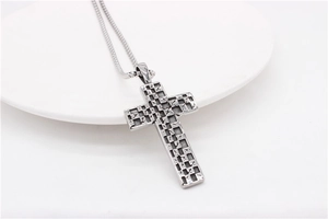 Detailed close-up of retro square mosaic cross pendant made of titanium steel on chain