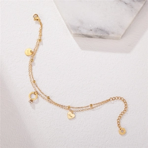 Double-layered gold titanium steel bracelet featuring a heart love pendant and zircon ring