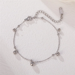 Sleek silver beaded link bracelet with minimalist bells and adjustable chain