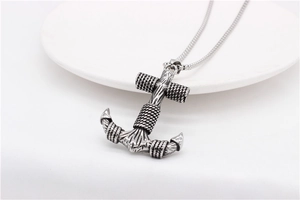 Close-up of vintage anchor pendant necklace with oxidized silver finish and snake chain