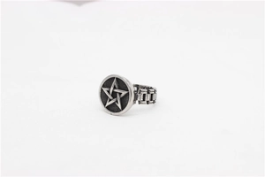 Macro shot of retro stainless steel star ring with a mechanical chain band detail