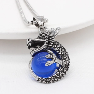 Vintage stainless steel dragon pendant necklace with a brilliant blue crystal bead
